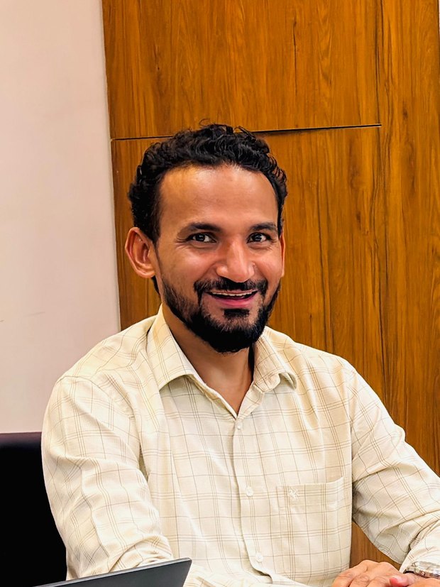 Asif Ali at his desk in Uttam Nagar, New Delhi